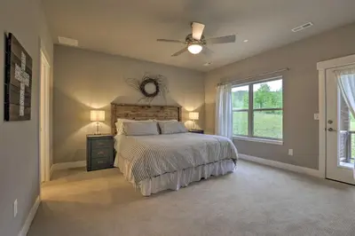 a bedroom with a bed and a ceiling fan at Fraser Retreat, Walk to Ski Shuttle and Main St in Fraser