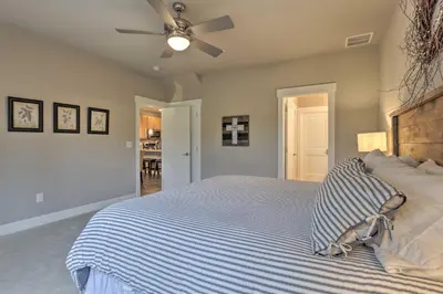 a bedroom with a bed and a ceiling fan at Fraser Retreat, Walk to Ski Shuttle and Main St in Fraser