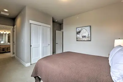 a bedroom with a bed in a room at Fraser Retreat, Walk to Ski Shuttle and Main St in Fraser