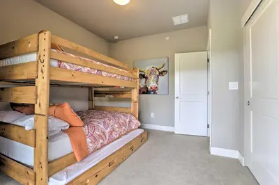 a bedroom with two bunk beds in a room at Fraser Retreat, Walk to Ski Shuttle and Main St in Fraser