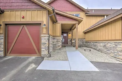 a garage with a red door on a house at Fraser Retreat, Walk to Ski Shuttle and Main St in Fraser