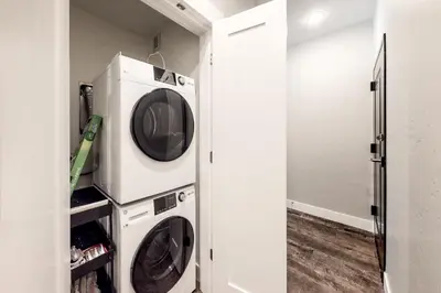 a laundry room with two washer and dryer at River West 811 in Silverthorne