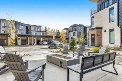 a group of chairs sitting on a patio in a city at River West 811 in Silverthorne