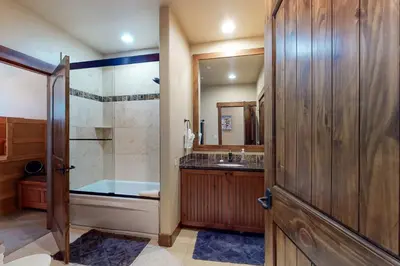 a bathroom with a shower and a sink at Riverfront Retreat in Silverthorne