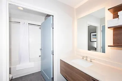 a bathroom with a sink and a mirror at Staybridge Suites - Denver North - Thornton by IHG in Thornton
