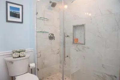 a bathroom with a shower with a toilet at 2800 Slopeside condo in Keystone