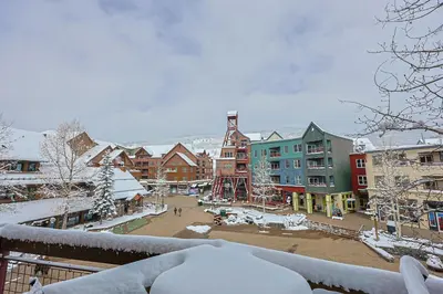 a snow covered town with buildings and a courtyard at Black Bear 2 Bed 2 Bath BBCS in Dillon