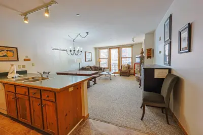 a kitchen with a sink and a living room at Black Bear 2 Bed 2 Bath BBCS in Dillon