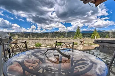 a circular plunge pool in a backyard with a grill at Fraser Condo with Views and Hot Tub Near Winter Park! in Fraser