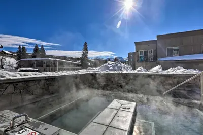 a hot tub with snow on top of it at Winter Park Condo with Fireplace - 4 Mi to Slopes! in Winter Park