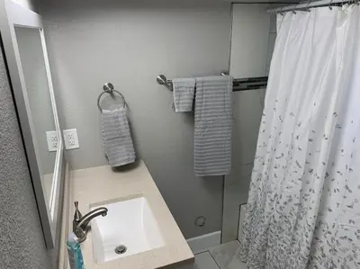 a bathroom with a sink and a shower at DIA HideAway -2BR, 15 min from DIA DT, Anschutz MD in Commerce City