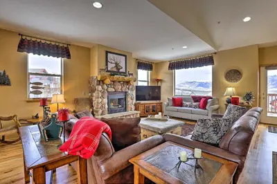 a living room with leather furniture and a fireplace at 11 Mi to Keystone Silverthorne Condo with Deck in Silverthorne