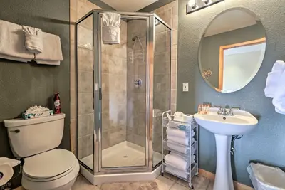 a bathroom with a shower and a toilet and a sink at 11 Mi to Keystone Silverthorne Condo with Deck in Silverthorne