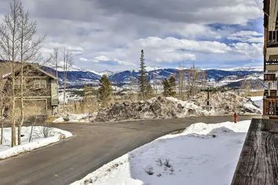 a street with snow on the ground and a building at 11 Mi to Keystone Silverthorne Condo with Deck in Silverthorne