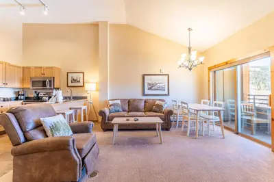 a living room with a couch and a table at Buffalo Lodge by Summit County Mountain Retreats in Keystone