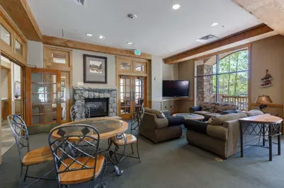 a living room filled with furniture and a fireplace at Buffalo Lodge by Summit County Mountain Retreats in Keystone