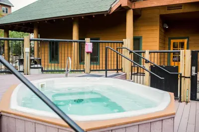 a hot tub in front of a house at Arapahoe Lodge by Summit County Mountain Retreats in Keystone