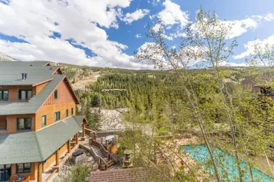 an aerial view of a house with a mountain at Dakota Lodge by Summit County Mountain Retreats in Keystone