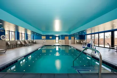 a large swimming pool in a building at Hampton Inn & Suites Aurora South, Co in Aurora