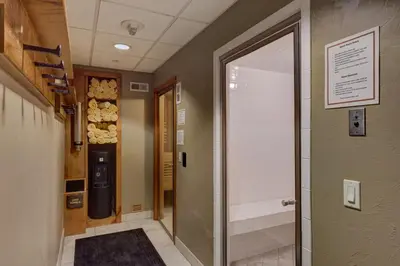 a hallway with a door leading into a room at Jackpine Lodge by Summit County Mountain Retreats in Keystone