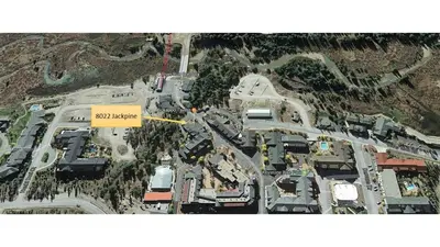 a map of a parking lot with a yellow sign at Jackpine Lodge by Summit County Mountain Retreats in Keystone