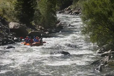 a group of people rafting down a river at Trademark Condo Short Walk to Shuttle in Winter Park