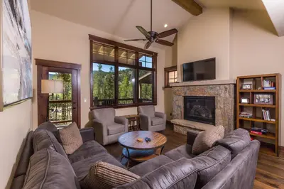 a living room with a couch and a fireplace at Alders by Summit County Mountain Retreats in Keystone