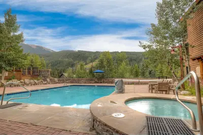 a swimming pool with a view of a mountain at Alders by Summit County Mountain Retreats in Keystone