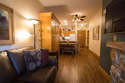 a living room with a couch and a table at Expedition Station by Summit County Mountain Retreats in Keystone