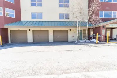 a building with two garage doors in front of it at Lakeshore by Summit County Mountain Retreats in Keystone