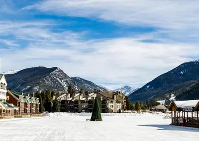 a resort in the mountains with snow on the ground at Lakeshore by Summit County Mountain Retreats in Keystone