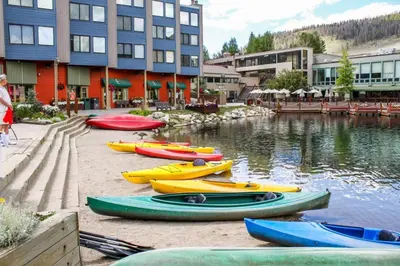 a group of kayaks parked next to a body of water at River Run Townhomes by Summit County Mountain Retreats in Keystone