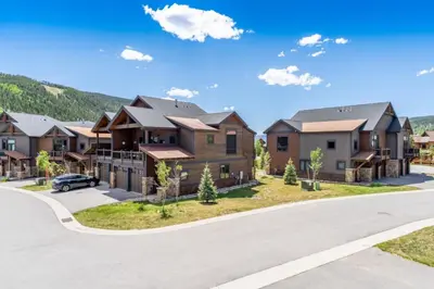 a row of houses in a residential neighborhood at River Run Townhomes by Summit County Mountain Retreats in Keystone