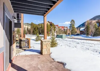 a porch of a house with snow on the ground at River Run Townhomes by Summit County Mountain Retreats in Keystone