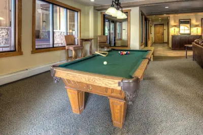 a billiard room with a pool table in it at Red Hawk Townhomes by Summit County Mountain Retreats in Keystone