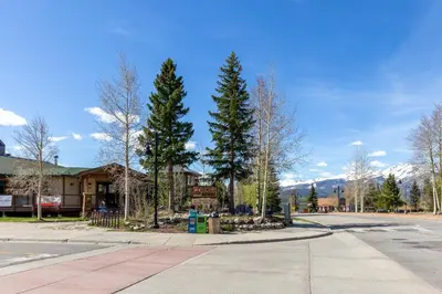 a street with trees in front of a building at Sail Lofts by Summit County Mountain Retreats in Dillon