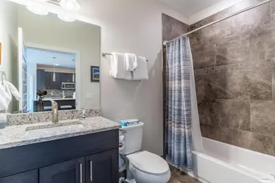 a bathroom with a toilet and a sink and a shower at Sail Lofts by Summit County Mountain Retreats in Dillon