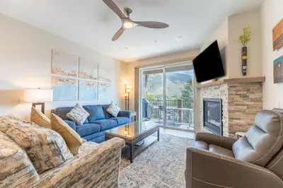 a living room with a couch and a fireplace at Sail Lofts by Summit County Mountain Retreats in Dillon