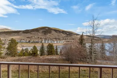 a view of a mountain and a body of water at The Lodge at Lake Dillon 111 in Dillon
