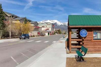 a building on the side of a street with a sign at The Lodge at Lake Dillon 111 in Dillon