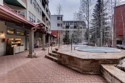 a building with a bath tub in the middle of a sidewalk at Silver Mill by Summit County Mountain Retreats in Keystone