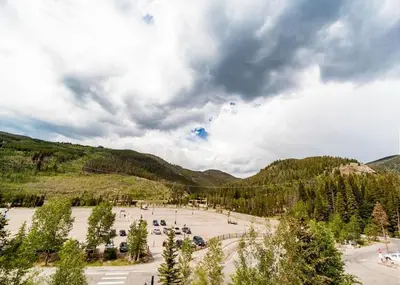 a parking lot with cars parked in a park at Silver Mill by Summit County Mountain Retreats in Keystone