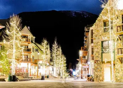 a town with christmas trees and buildings with lights at Oro Grande by Summit County Mountain Retreats in Keystone