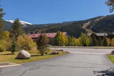 an empty road with rocks on the side of a mountain at Oro Grande by Summit County Mountain Retreats in Keystone