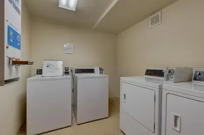 three washers and dryers in a room at Oro Grande by Summit County Mountain Retreats in Keystone