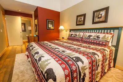 a bedroom with a large bed in a room at Pines by Summit County Mountain Retreats in Keystone