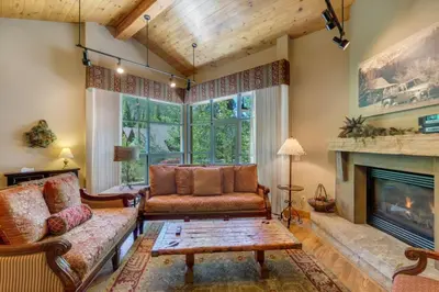 a living room with a couch and a fireplace at Ski Tip by Summit County Mountain Retreats in Keystone