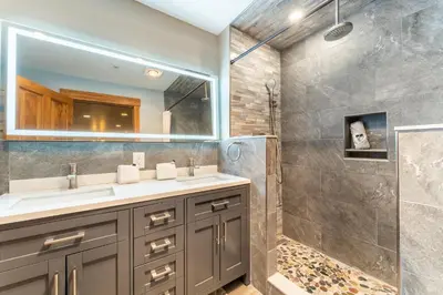 a bathroom with a sink and a shower at Springs by Summit County Mountain Retreats in Keystone