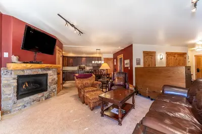 a living room with a couch and a fireplace at Tenderfoot Lodge by Summit County Mountain Retreats in Keystone