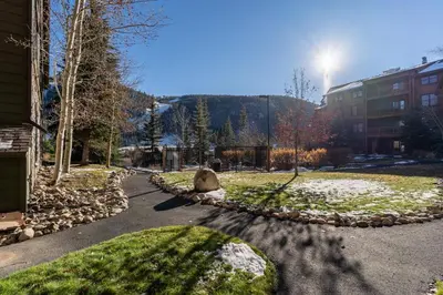 a park with a rock in the middle of a street at Tenderfoot Lodge by Summit County Mountain Retreats in Keystone